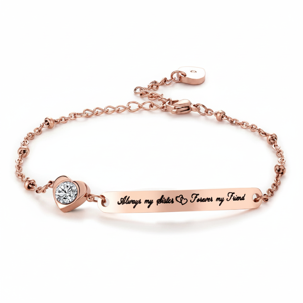 Rose gold bracelet featuring a horizontal bar engraved with 'Always my sister & forever my friend' and a heart-shaped bezel-set clear stone, shown on a white background.
