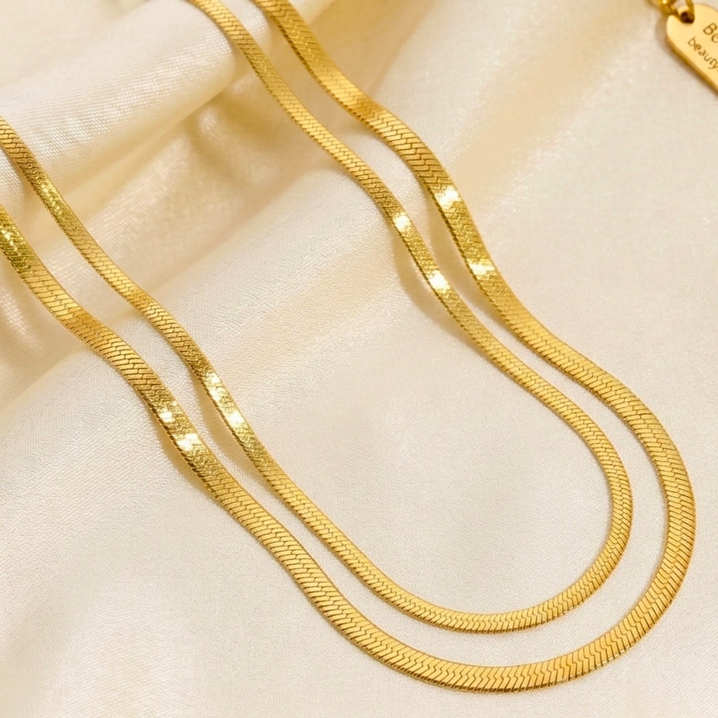 beautymogul-gold-snake-chain-60cm-lifestyle-white-satin